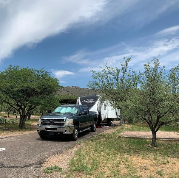 An RV parked in a camping space at Kartchner Caverns State Park