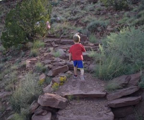 A child hiking the trail at Lyman Lake State Park
