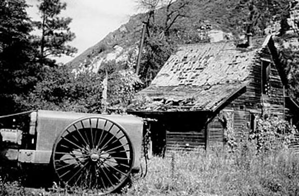 A sprayer and the Brown House in 1984.