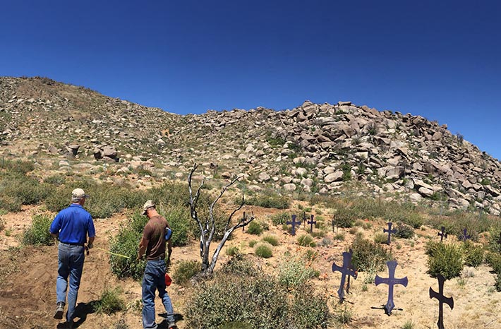 A view up from the fatality site, with crosses placed for the men